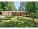 Charming brick ranch home with a well-maintained lawn and mature trees at 213 Linda Dr, Tucker, GA 30084