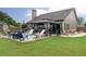Spacious backyard patio has a gazebo, a gas fire pit, and plenty of seating, perfect for relaxation at 2256 Long Bow Chase Nw, Kennesaw, GA 30144