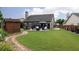 Large backyard with shed, patio with gazebo, fire pit and abundant green space perfect for outdoor entertainment at 2256 Long Bow Chase Nw, Kennesaw, GA 30144