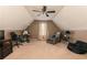 Spacious bonus room with vaulted ceiling, ceiling fan, reading nook, and comfy seating offers versatile living space at 2256 Long Bow Chase Nw, Kennesaw, GA 30144