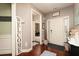 Inviting entryway with hardwood floors, neutral walls, and a view into other rooms, creating a warm and welcoming atmosphere at 2256 Long Bow Chase Nw, Kennesaw, GA 30144