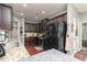 This kitchen features stainless steel appliances, granite counters, dark cabinets, and hardwood floors at 2256 Long Bow Chase Nw, Kennesaw, GA 30144