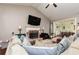Bright and airy living room with vaulted ceilings, a fireplace, and hardwood floors, creating a comfortable space at 2256 Long Bow Chase Nw, Kennesaw, GA 30144