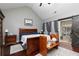The main bedroom features a vaulted ceiling, private bath, and a private door to sunroom at 2256 Long Bow Chase Nw, Kennesaw, GA 30144