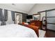 Bright main bedroom with wood floors, en-suite bath, and a large dresser and mirror at 2256 Long Bow Chase Nw, Kennesaw, GA 30144