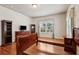 Large bedroom with hardwood floors, large windows and matching furniture at 3491 Amerigo Dr, Buford, GA 30519