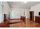 Spacious bedroom featuring hardwood floors, double closet, and adjacent ensuite bathroom at 3491 Amerigo Dr, Buford, GA 30519