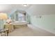 Cozy bedroom features neutral carpet, light green walls, and a window at 3491 Amerigo Dr, Buford, GA 30519