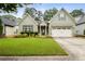 Charming one-story home with well-maintained lawn and a two car garage, with updated siding and trim at 3491 Amerigo Dr, Buford, GA 30519