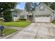 Charming one-story home with well-maintained lawn and a two car garage, with updated siding and trim at 3491 Amerigo Dr, Buford, GA 30519
