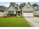 Charming one-story home with well-maintained lawn and a two car garage, with updated siding and trim at 3491 Amerigo Dr, Buford, GA 30519