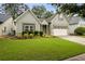 Charming one-story home with well-maintained lawn and a two car garage, with updated siding and trim at 3491 Amerigo Dr, Buford, GA 30519