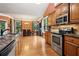 Modern kitchen with stainless steel appliances and granite countertops offering an adjacent dining area at 3491 Amerigo Dr, Buford, GA 30519