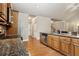 Updated kitchen with granite countertops, stainless steel appliances, and seamless access to the hallway at 3491 Amerigo Dr, Buford, GA 30519