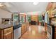 Well-appointed kitchen featuring granite countertops, stainless steel appliances, and an adjacent dining area at 3491 Amerigo Dr, Buford, GA 30519