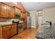 Well-equipped kitchen with stainless steel appliances, granite countertops, and ample wood cabinetry at 3491 Amerigo Dr, Buford, GA 30519