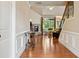 Spacious living room featuring hardwood floors, a stone fireplace, and large windows for plenty of natural light at 3491 Amerigo Dr, Buford, GA 30519