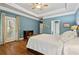 Main bedroom with hardwood floors, ensuite bathroom access, and a private doorway at 3491 Amerigo Dr, Buford, GA 30519