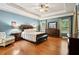 Spacious main bedroom features hardwood floors, tray ceilings, and a sitting area at 3491 Amerigo Dr, Buford, GA 30519