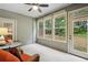 Inviting sunroom with cozy seating, lots of natural light, and an outdoor view at 3491 Amerigo Dr, Buford, GA 30519