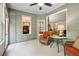 Bright sunroom features neutral carpet and views of nature and interior spaces at 3491 Amerigo Dr, Buford, GA 30519