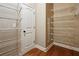 Walk-in closet with an abundance of metal shelving and hardwood floors at 3491 Amerigo Dr, Buford, GA 30519