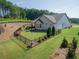 Backyard with a fenced in area, patio set and umbrella, and mature trees at 400 Southland Cir, Canton, GA 30115