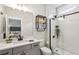 Stylish bathroom with glass shower, gray vanity, and modern fixtures at 400 Southland Cir, Canton, GA 30115