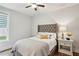 Cozy bedroom with a comfortable bed, tufted headboard, and soft natural lighting at 400 Southland Cir, Canton, GA 30115