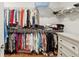 Walk-in closet with hanging racks and shelves for organized storage solutions at 400 Southland Cir, Canton, GA 30115