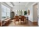 Bright dining room featuring hardwood floors, tray ceiling and natural lighting at 400 Southland Cir, Canton, GA 30115