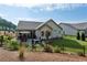 Home exterior with fenced backyard, patio with outdoor dining, fire pit area, and landscaping at 400 Southland Cir, Canton, GA 30115