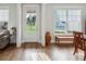 Light-filled foyer with hardwood floors, neutral paint, and attractive front door at 400 Southland Cir, Canton, GA 30115