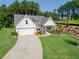 Attractive single Gathering home with well-manicured lawn and two car garage at 400 Southland Cir, Canton, GA 30115