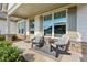 Inviting front porch with rocking chairs and decorative stone accents at 400 Southland Cir, Canton, GA 30115