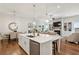 Open concept kitchen with a large island, stainless steel appliances, and hardwood floors at 400 Southland Cir, Canton, GA 30115