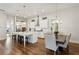 Bright kitchen with stainless appliances, center island, and an adjacent dining area at 400 Southland Cir, Canton, GA 30115