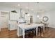 Spacious kitchen with a large center island, white cabinets, and stainless steel appliances at 400 Southland Cir, Canton, GA 30115