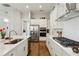 Modern kitchen with stainless steel appliances, subway tile backsplash, and ample counter space at 400 Southland Cir, Canton, GA 30115