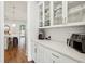 Bright pantry with white cabinets, subway tile backsplash, and modern appliances at 400 Southland Cir, Canton, GA 30115