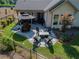 Back patio with furniture, a table, umbrella, fire pit, and greenery at 400 Southland Cir, Canton, GA 30115
