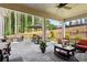Spacious outdoor patio featuring stone pavers, comfortable seating and wooded view at 400 Southland Cir, Canton, GA 30115