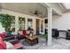 Covered outdoor patio features comfortable seating and grilling area for outdoor entertaining at 400 Southland Cir, Canton, GA 30115