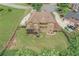 Aerial view showcasing brick home with a spacious yard, patio, and neighboring houses at 602 Davenport Pl, Canton, GA 30115