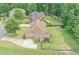Aerial view of home showcasing backyard, mature trees, and surrounding neighborhood at 602 Davenport Pl, Canton, GA 30115