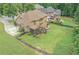 Large, fenced backyard featuring a screened porch and spacious grassy area at 602 Davenport Pl, Canton, GA 30115