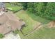Large backyard, partially fenced, with mature trees, and a screened in porch at 602 Davenport Pl, Canton, GA 30115
