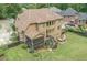 Expansive backyard featuring a screened porch, deck, patio, and ample space for outdoor enjoyment at 602 Davenport Pl, Canton, GA 30115