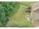 An expansive backyard featuring lush greenery, a patio area, and a perfect space for recreation at 602 Davenport Pl, Canton, GA 30115