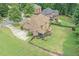 Large, fenced backyard featuring a screened porch and spacious grassy area at 602 Davenport Pl, Canton, GA 30115